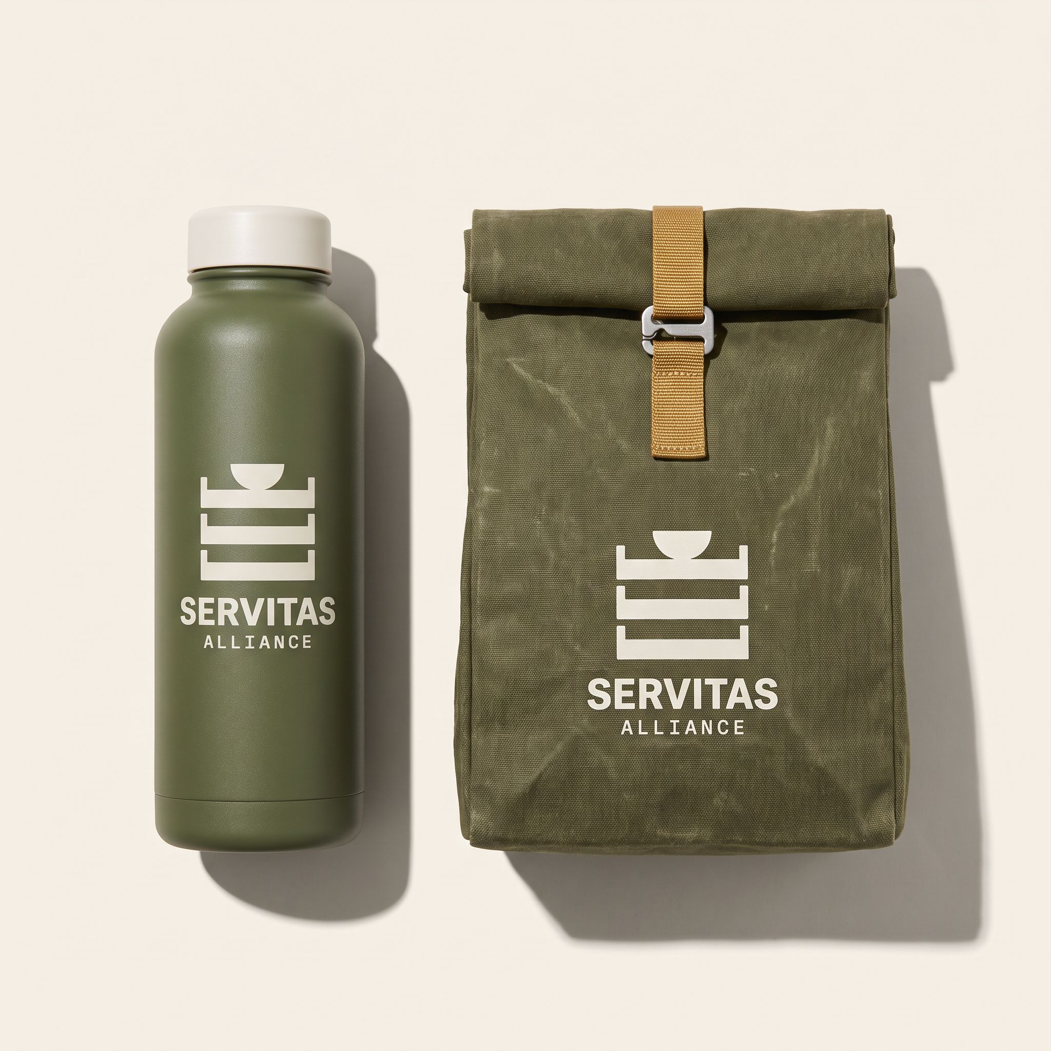 Servitas Bottle & Lunch Tote Set: Insulated steel bottle and a waxed canvas lunch tote for long route days.